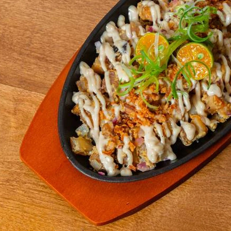 Sizzling Pork Sisig served on a hot plate at Byrne Eats, Old East Village, London, Ontario